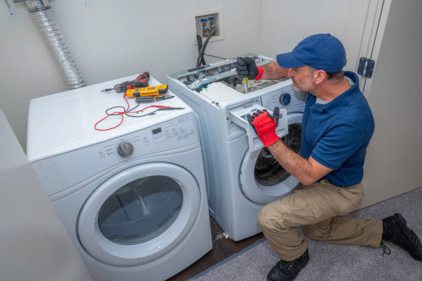 Gas dryer repairs near me technician fixing gas dryer in Ontario home